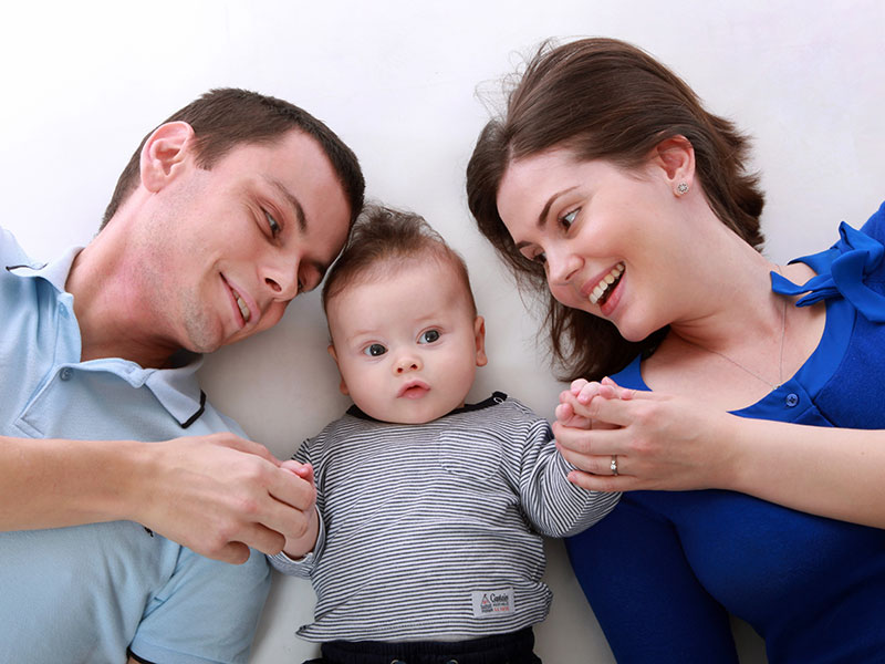 mother and father with a baby